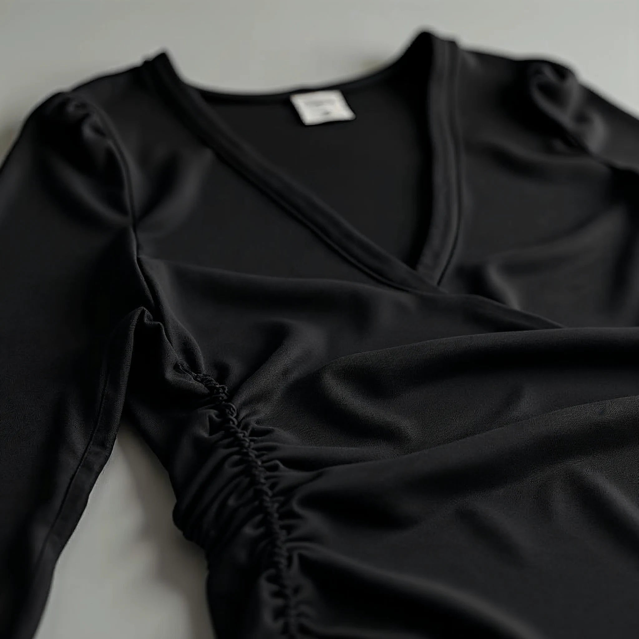 Elowyn - Ruched-Waist Deep V-Neck Top