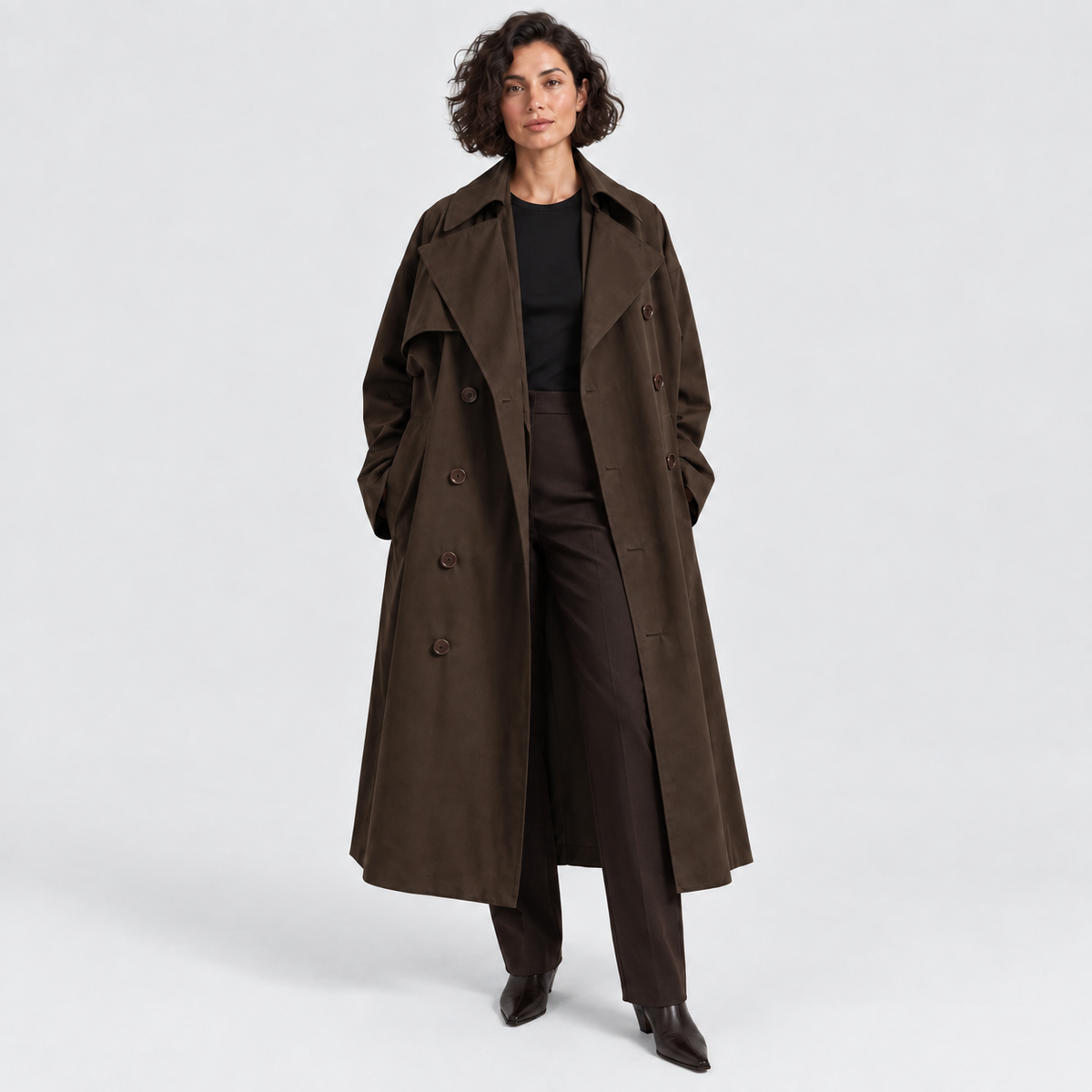 Double-breasted long trench coat with wide lapels in brown, front view on model