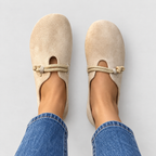 Round-toe loafers with rope detail in beige, front view on model