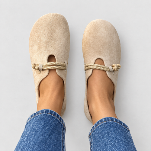 Round-toe loafers with rope detail in beige, front view on model