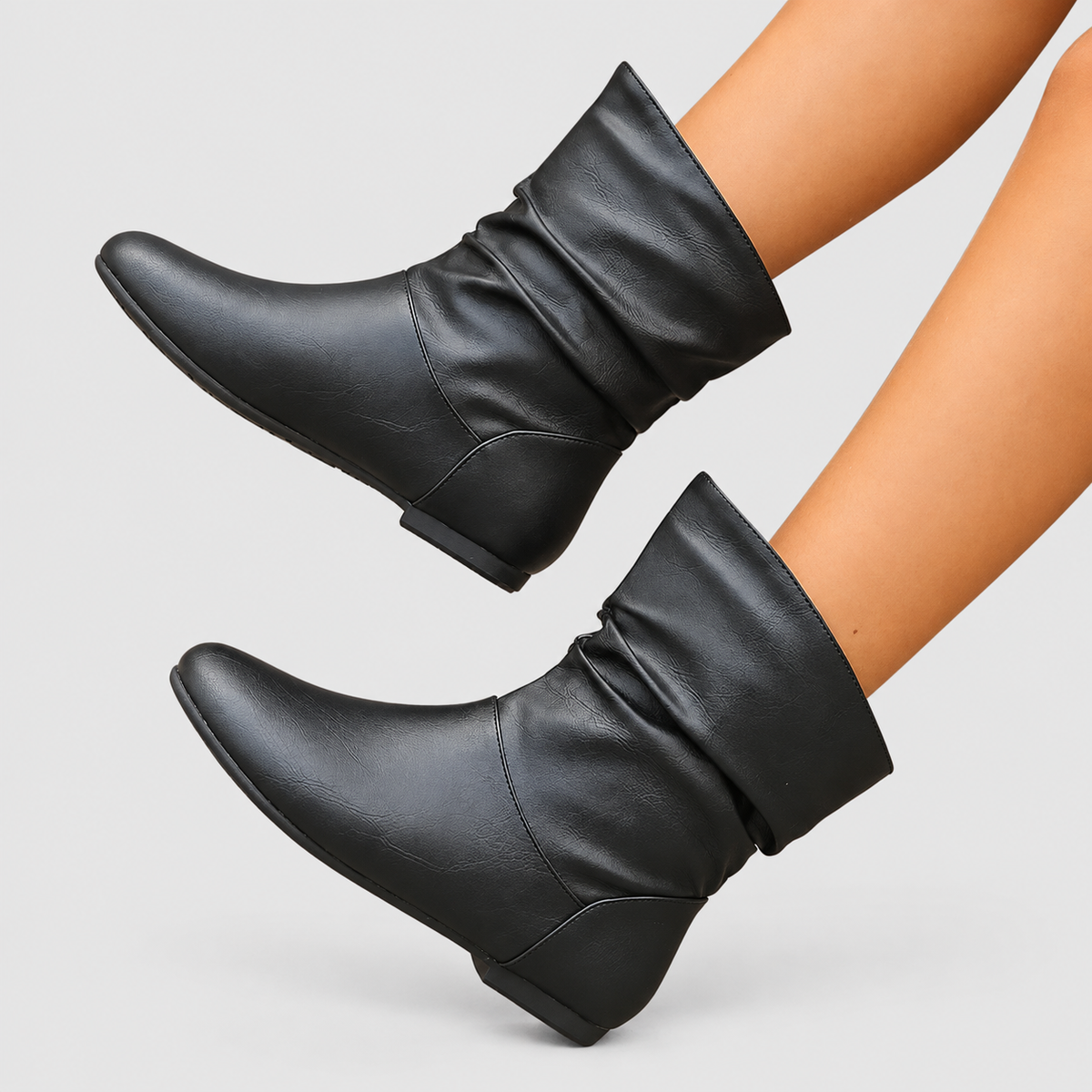 Women's Flat Slouch Faux Leather Ankle Boots in Black — view 1